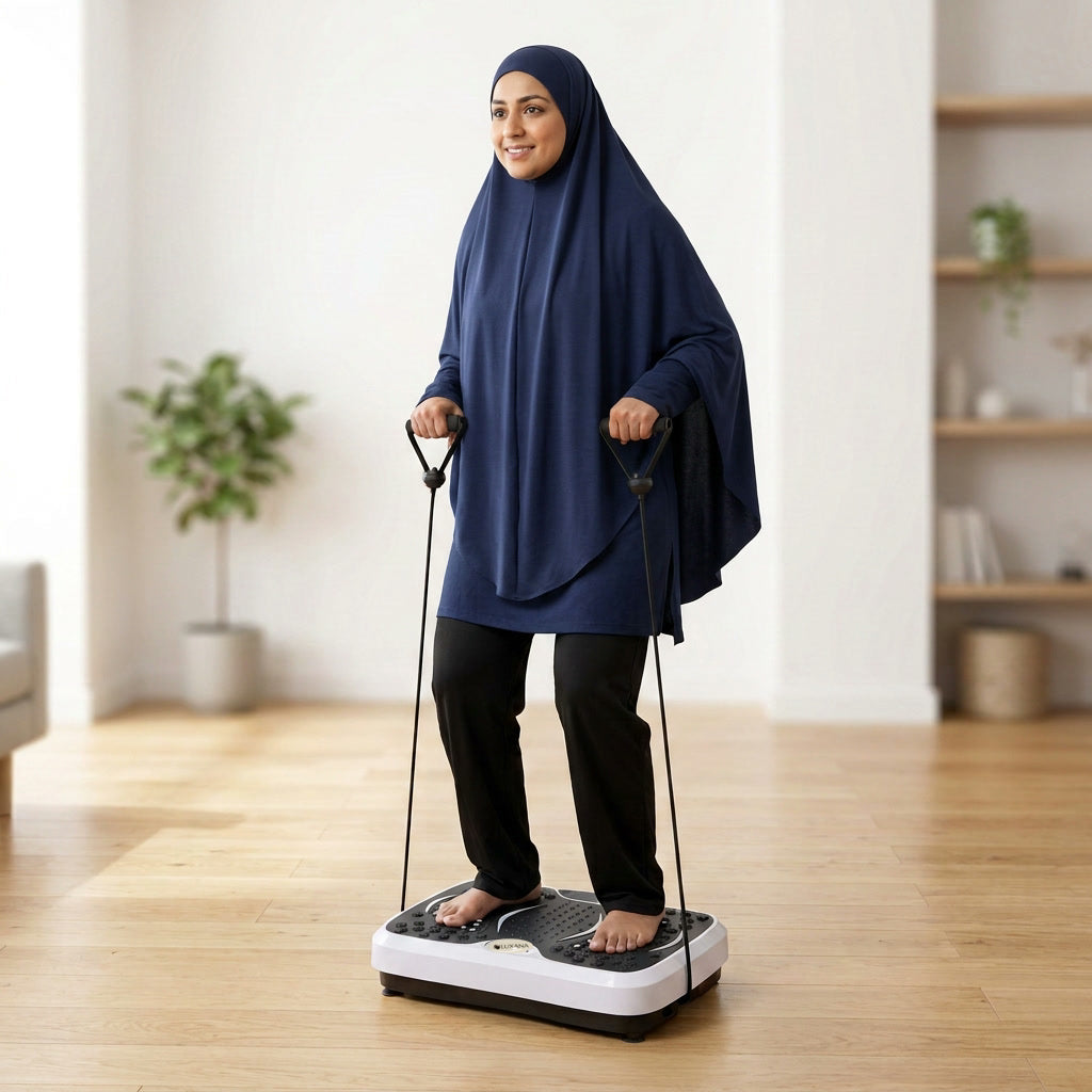 Woman in hijab using arm bands on The Vibra vibration plate at home