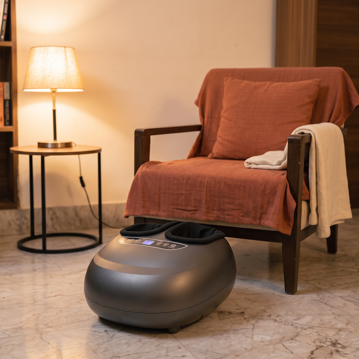 The Ritorno on a marble floor in front of an armchair, evening lamplight