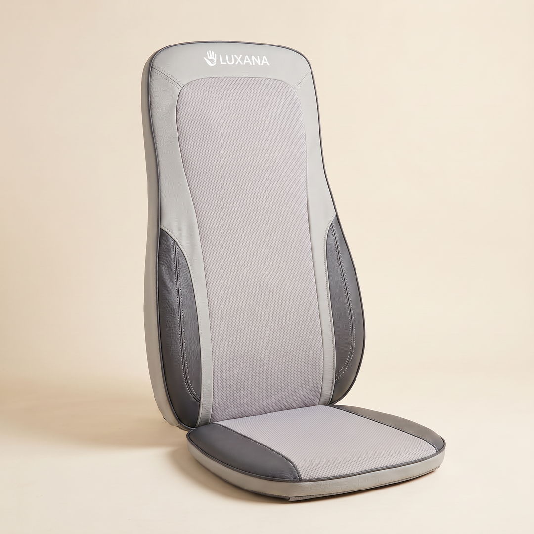 The Sereno Drive shiatsu massage seat in light grey, studio shot on ivory