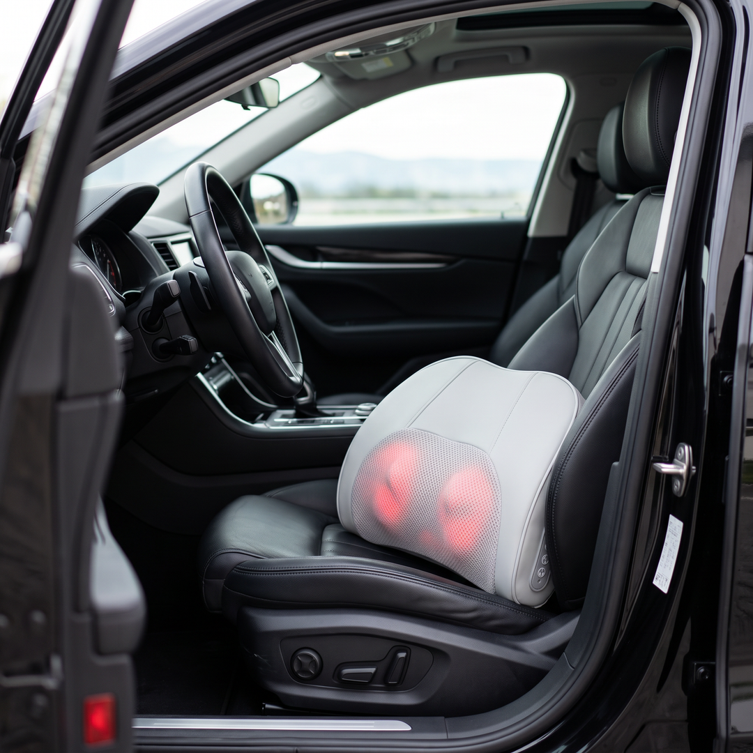 The cordless Piuma resting against a car's driver seat