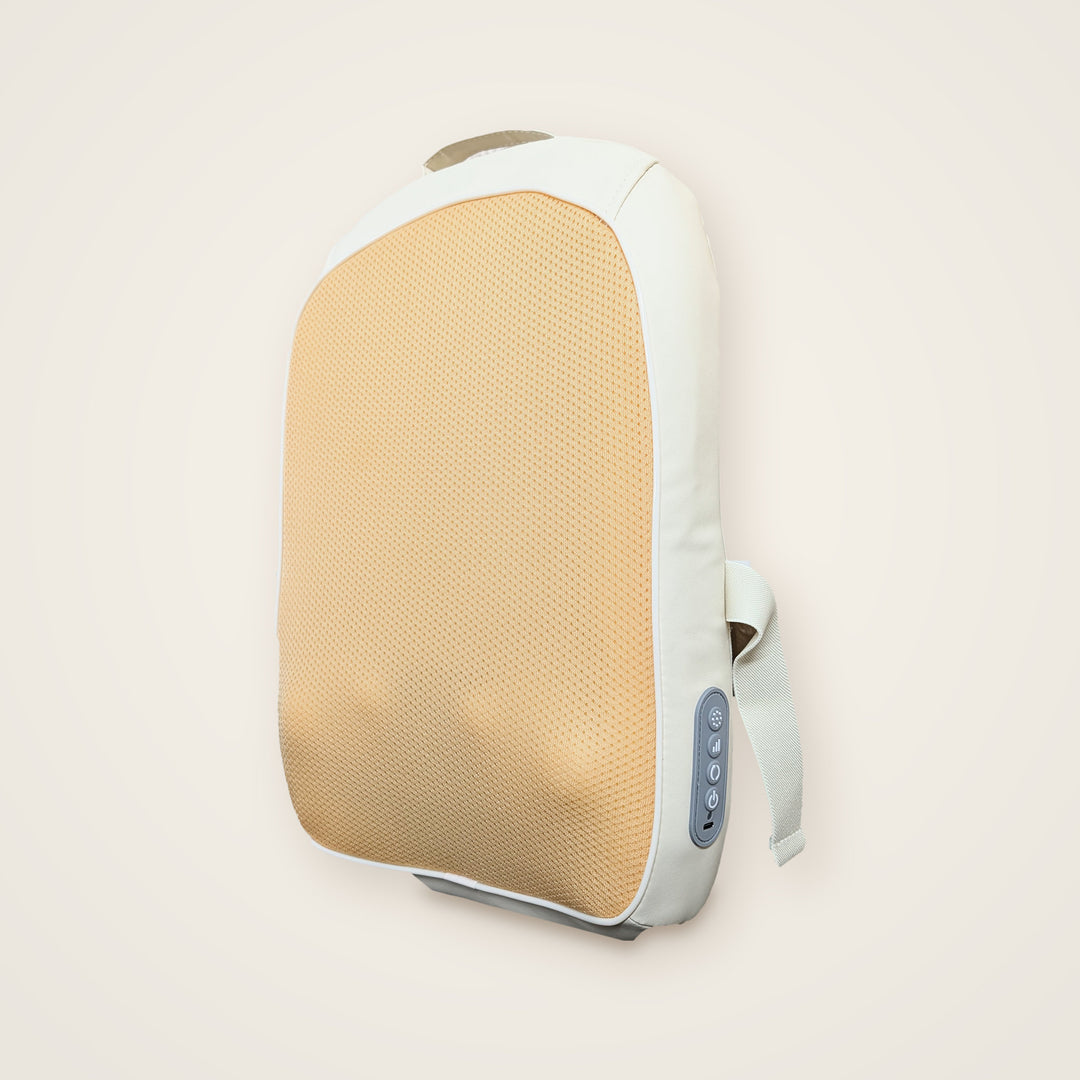 A portable neck and shoulder massage pillow with a beige textured mesh pad and a white fabric body, shown against a solid light beige background.