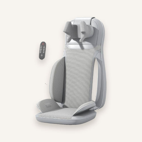 The Sereno shiatsu massage seat in cloud grey with corded remote, on an ivory background